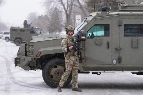 An FBI officer works the scene during operations on Friday, Jan. 16, 2026, in St. Paul, Minn. (AP Photo/Adam Gray)