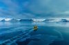 FILE - A boat rides though a frozen sea inlet outside of Nuuk, Greenland, on March 6, 2025. (AP Photo/Evgeniy Maloletka, File)