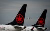 Air Canada Boeing 737 MAX 8 aircraft sit parked at Vancouver International Airport, in Richmond, B.C., on Monday, August 18, 2025. THE CANADIAN PRESS/Darryl Dyck