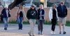 A group of people walk up to St. Philip's in the Hills Episcopal Church to attend the candlelight service for Nancy Guthrie, the 84-year-old mother of NBC 