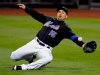 FILE - New York Mets right fielder Carlos Beltran lunges for the ball during the third inning of an MLB baseball game against the Arizona Diamondbacks, April 22, 2011 in New York. (AP Photo/Bill Kostroun, File)