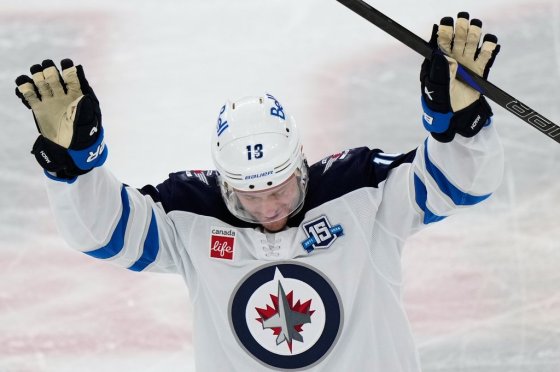 Winnipeg Jets centre Jonathan Toews waves to the crowd during the first period of an NHL hockey game against the Chicago Blackhawks in Chicago, Monday, Jan. 19, 2026. (Nam Y. Huh / The Associated Press files)