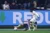 Union SG's Kevin Mac Allister, left, and Atalanta's Ademola Lookman challenge for the ball during the Champions League opening phase soccer match between Union Saint-Gilloise and Atalanta, in Brussels, Wednesday, Jan. 28, 2026. (AP Photo/Omar Havana)