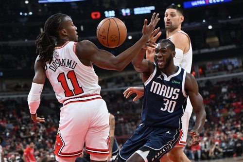 Dallas Mavericks' Moussa Cisse (30) battles Chicago Bulls' Ayo Dosunmu (11) for the ball during the first half of an NBA basketball game Saturday, Jan. 10, 2026, in Chicago. (AP Photo/Paul Beaty)