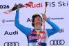Italy's Giovanni Franzoni celebrates on podium winning a men's alpine ski World Cup downhill, in Kitzbuehel, Austria, Saturday, Jan. 24, 2026. (AP Photo/Marco Trovati)