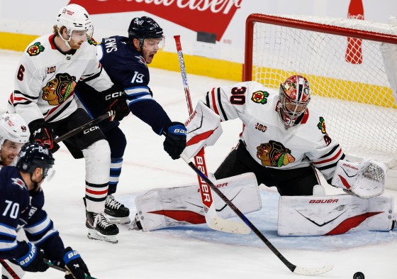 Chicago Blackhawks' Sam Rinzel (6) defends against Winnipeg Jets' Jonathan Toews (19) during the teams' last meeting in Winnipeg Oct. 30, 2025. (John Woods / The Canadian Press files)