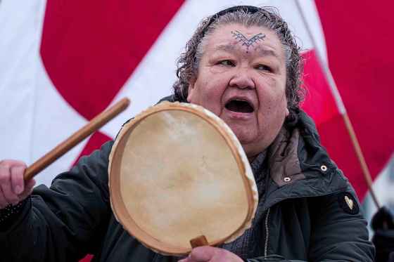 An Inuit woman sings a national song during a protest against Trump's policy towards Greenland in front of the US consulate in Nuuk, Greenland, Saturday, Jan. 17, 2026. (Evgeniy Maloletka / The Associated Press files)