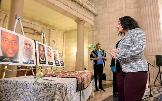 Minister Nellie Kennedy lays a rose in front of a memorial dedicated to the six victims of the 2017 Quebec City Mosque shooting. (Mike Sudoma / Free Press)