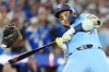 Toronto Blue Jays' Bo Bichette (11) ducks a high and inside pitch to walk against the Los Angeles Dodgers during sixth inning Game 6 World Series playoff MLB baseball action in Toronto on Friday, Oct. 31, 2025. THE CANADIAN PRESS/Frank Gunn