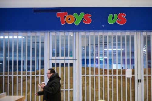 Shoppers pass a permanently closed Toys 'R' Us store in Toronto, on Wednesday, Feb. 4, 2026. THE CANADIAN PRESS/Sammy Kogan
