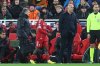 Liverpool's Jeremie Frimpong, centre, goes off injured past Liverpool's manager Arne Slot during the Champions League soccer match between Liverpool and Qarabag in Liverpool, Wednesday, Jan. 28, 2026. (AP Photo/Darren Staples)