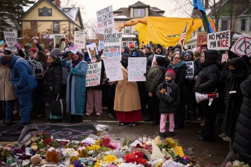 Protesters react as they visit a makeshift memorial during a rally for Renee Good, who was fatally shot by an ICE officer earlier in the week, Saturday, Jan. 10, 2026, in Minneapolis. (AP Photo/John Locher)