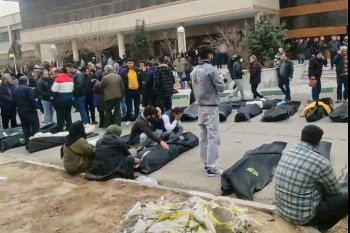This frame grab from videos taken between Jan. 9 and Jan. 11, 2026, and circulating on social media purportedly shows images from a morgue with dozens of bodies and mourners after crackdown on the outskirts of Iran's capital, in Kahrizak, Tehran Province. (UGC via AP)
