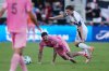 Inter Miami's Rodrigo de Paul (7) is taken down by Vancouver Whitecaps' Ryan Gauld (25) during the second half of the MLS Cup final soccer match, in Fort Lauderdale, Fla., on Saturday, December 6, 2025. THE CANADIAN PRESS/Darryl Dyck