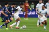 Marseille's Emerson Palmieri, center, is challenged during the French Super Cup soccer match between PSG and Marseille in Kuwait City, Kuwait, Thursday, Jan. 8, 2026. (AP Photo/Jaber Abdulkhaleg)