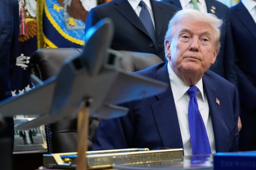 President Donald Trump listens to a question from a reporter as he speaks in the Oval Office of the White House, Monday, Feb. 2, 2026, in Washington. (AP Photo/Alex Brandon)