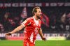 Munich's Harry Kane celebrates scoring during the Bundesliga soccer match between Bayern Munich and VfL Wolfsburg in Munich, Germany, Sunday Jan. 11, 2026. (Tom Weller/dpa via AP)