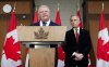 Ontario Premier Doug Ford speaks as Prime Minister Mark Carney, right, looks on during an announcement on Parliament Hill in Ottawa on Thursday, Dec. 18, 2025. THE CANADIAN PRESS/Sean Kilpatrick