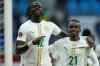 Senegal's Cherif Ndiaye, left, and Cheikh Sabaly celebrate after a goal during the Africa Cup of Nations group D soccer match between Senegal and Botswana in Tangier, Morocco, Tuesday, Dec. 23, 2025. (AP Photo/Mosa'ab Elshamy)