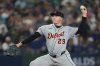 FILE - Detroit Tigers pitcher Tarik Skubal throws during the first inning in Game 5 of baseball's American League Division Series against the Seattle Mariners, Oct. 10, 2025, in Seattle. (AP Photo/Lindsey Wasson, File)