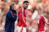 FILE - Manchester United's Casemiro, center, leaves the field with medics after sustaining an injury during the English Premier League soccer match between Manchester United and Brentford at Old Trafford stadium in Manchester, England, Oct. 19, 2024. (AP Photo/Dave Thompson, File)