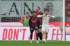 Genoa's Nicolae Stanciu, right, reacts after missing a chance to score from a penalty spot during the Serie A soccer match between AC Milan and Genoa, in Milan, Italy, Thursday, Jan. 8, 2026. (AP Photo/Antonio Calanni)