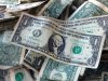 FILE - This Oct. 24, 2016 file photo shows dollar bills in New York. (AP Photo/Mark Lennihan, File)