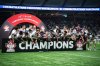 Vancouver Whitecaps' Ryan Gauld, centre, prepares to hoist the Voyageurs Cup with his team after defeating Vancouver FC in the Canadian Championship final soccer match in Vancouver, on Wednesday, Oct. 1, 2025. THE CANADIAN PRESS/Ethan Cairns