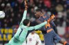 Inter Milan's Ange-Yoan Bonny, right, scores against Torino during an Italian Cup soccer match in Monza, Italy, Wednesday, Feb. 4 , 2026. (Spada/LaPresse via AP)