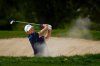 Patrick Reed of the United States hits a shot from a bunker on the first hole during the third round of the Dubai Desert Classic in United Arab Emirates, Saturday, Jan. 24, 2026. (AP Photo/Altaf Qadri)