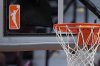 FILE - The WNBA logo is seen near a hoop before an WNBA basketball game at Mohegan Sun Arena, May 14, 2019, in Uncasville, Conn. (AP Photo/Jessica Hill, File)