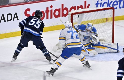 Winnipeg Jets' Mark Scheifele (55) scores on St. Louis Blues' goaltender Joel Hofer (30) during the first period of their NHL hockey game in Winnipeg, Tuesday Jan. 20, 2026. THE CANADIAN PRESS/Fred Greenslade