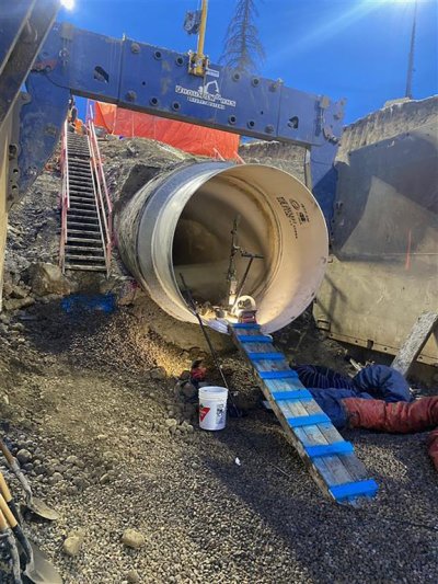 Crews work on repairing the water main break along 16 Ave. N.W., in Calgary, on Tuesday, Jan. 6, 2026 in this handout photo provided the City of Calgary. THE CANADIAN PRESS/Handout - City of Calgary (Mandatory Credit)