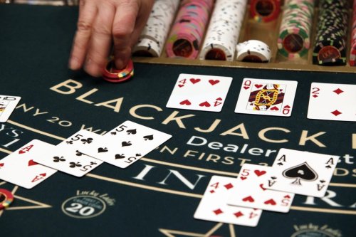 A dealer slides chips across the blackjack table on Friday, March 16, 2012. THE CANADIAN PRESS/AP-Robert F. Bukaty