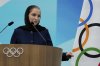Iranian badminton player Soraya Aghaei Hajiagha speaks during her oath ceremony as a newly appointed member of the International Olympic Committee (IOC) during the 145th IOC session ahead of the 2026 Winter Olympics, in Milan, Italy, Wednesday, Feb. 4, 2026 (AP Photo/Luca Bruno)