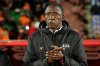 Burkina Faso's head coach Brama Traoe Traore concentrates before the Africa Cup of Nations best of 16 soccer match between Ivory Coast and Burkina Faso in Marrakech, Morocco, Tuesday, Jan. 6, 2026. (AP Photo/Themba Hadebe)