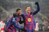 Barcelona's Robert Lewandowski, right, celebrates with his teammate Marcus Rashford after scoring his side's fourth goal during the Champions League opening phase soccer match between Slavia Prague and Barcelona in Prague, Czech Republic, Wednesday, Jan. 21, 2026. (AP Photo/Petr David Josek)