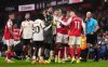 Players react to Arsenal's Gabriel Martinelli after he moved Liverpool's Conor Bradley, not in photo, who was injured off the pitch during the English Premier League soccer match in London, Thursday Jan. 8, 2026. (John Walton/PA via AP)
