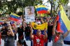 Supporters of former president Nicolas Maduro take part in a government-organized evangelical gathering calling for his release after U.S. forces captured him, in Caracas, Venezuela, Sunday, Jan. 11, 2026. (AP Photo/Cristian Hernandez)