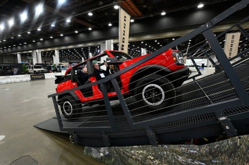 FILE - Guests are given a ride in a Bronco on a track at the Detroit Auto Show, Friday, Jan. 10, 2025, in Detroit. (AP Photo/Jose Juarez, file)