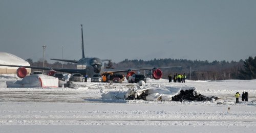 Investigators from the Federal Aviation Administration and National Transportation Safety Board investigate a plane crash at Bangor International Airport Wednesday, Jan. 28, 2026 in Bangor, Maine. (Linda Coan O'Kresik/The Bangor Daily News via AP)