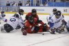 Greg Westlake of Canada (12) and Lee Yong-min of South Korea (23) battle for the puck during a semifinal of the ice hockey game at the 2018 Winter Paralympics in Gangneung, South Korea, Thursday, March 15, 2018. (AP Photo/Lee Jin-man)