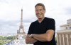 Broadcaster Scott Russell poses for a photo at the television booth where he hosts Summer Olympic coverage for CBC, in Paris, Friday, Aug. 9, 2024. THE CANADIAN PRESS/Adrian Wyld