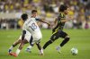 Columbus Crew midfielder Aziel Jackson, right, controls the ball against Vancouver Whitecaps defender Édier Ocampo (18) during an MLS soccer match Saturday, June 14, 2025, in Columbus, Ohio. (AP Photo/Jeff Dean)