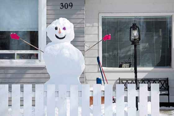 A large snowman sits in front of a home in Brandon. (Tim Smith / The Brandon Sun files)