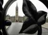 The Parliament building are framed through a fence on Parliament Hill in Ottawa Sunday, Sept. 25, 2005. The House of Commons starts its fall session on Monday and Michaelle Jean will be sworn in as the new Governor General will be sworn in on Tuesday. (CP PHOTO/Jonathan Hayward)
