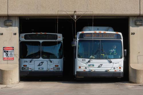 MIKE DEAL / FREE PRESS FILES
                                Winnipeg transit buses leave the Osborne Street Garage Wednesday morning. 250709 - Wednesday, July 09, 2025.