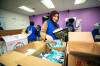 MIKAELA MACKENZIE / FREE PRESS
                                Iqra Tariq packs Ramadan hampers for Volunteers with Islamic Relief at Healthy Muslim Families on Thursday.