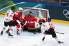 DARRYL DYCK / THE CANADIAN PRESS

Canada’s Sarah Fillier (10) scores a goal against Switzerland goalie Saskia Maurer (29) as Canada’s Natalie Spooner (24) and Switzerland’s Stefanie Wetli (18) watch the puck go in during the third period of a preliminary round women’s hockey game at the Milan Cortina Winter Olympics, in Milan, on Saturday.