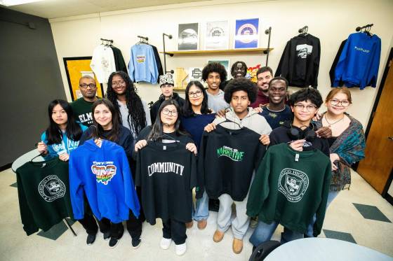 Elmwood High students with products from Elmwood Supply Company, their student-led clothing and keepsake brand. (Mikaela MacKenzie / Free Press)